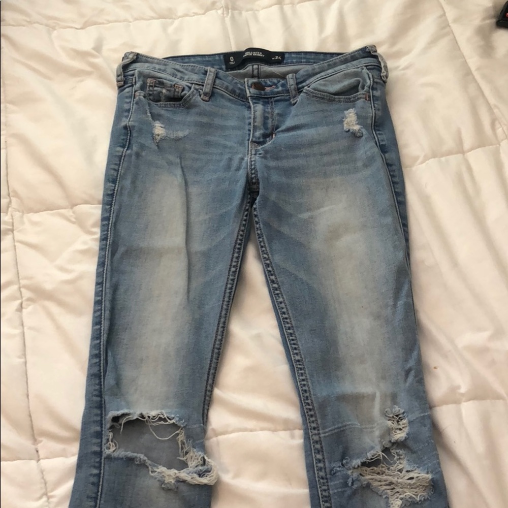 lighter blue skinny jeans with rips